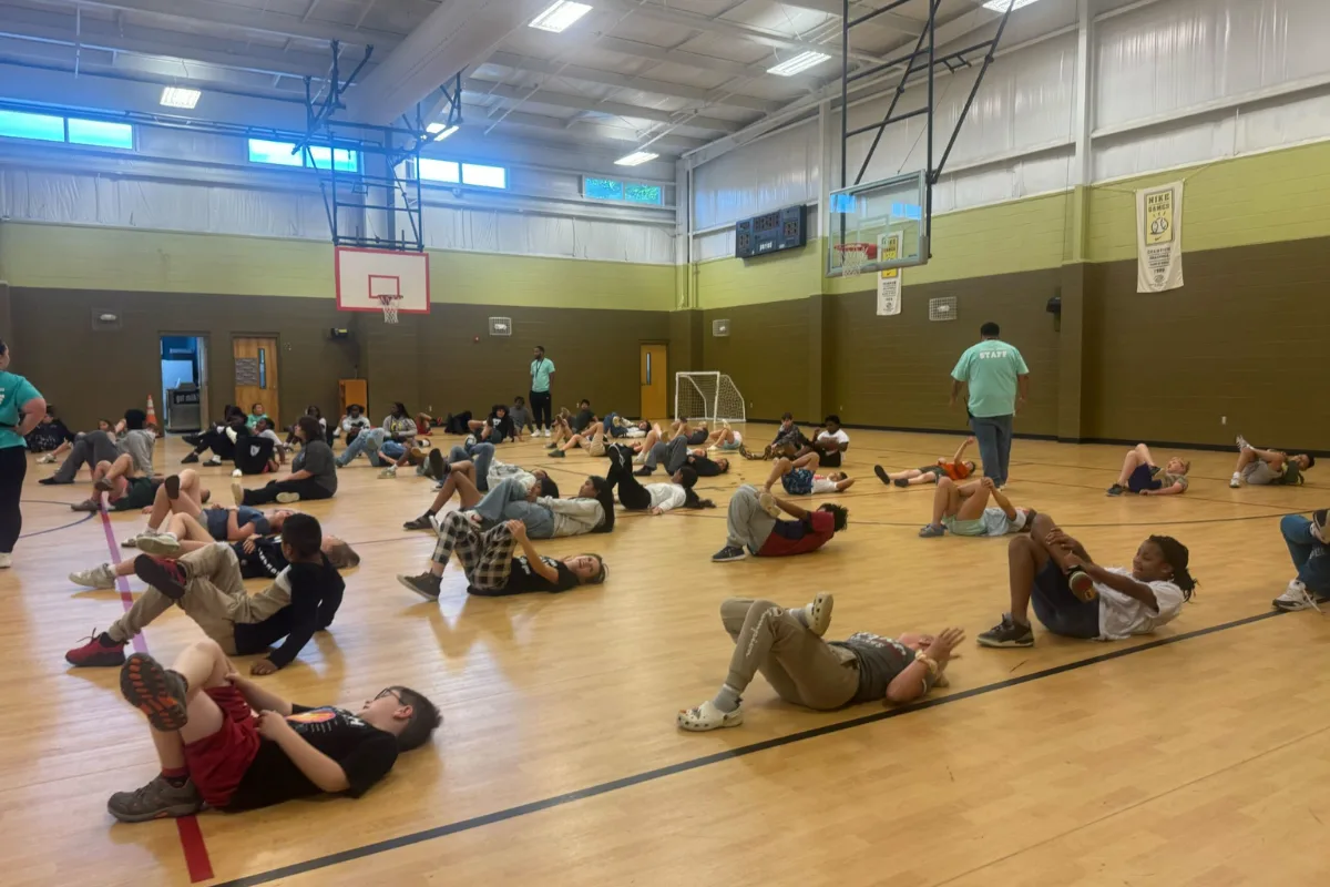 Group seated in gym or community space