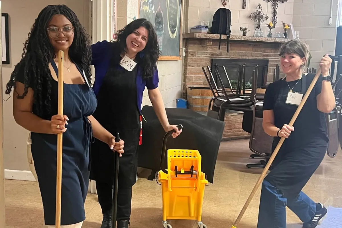 Two people cleaning indoors