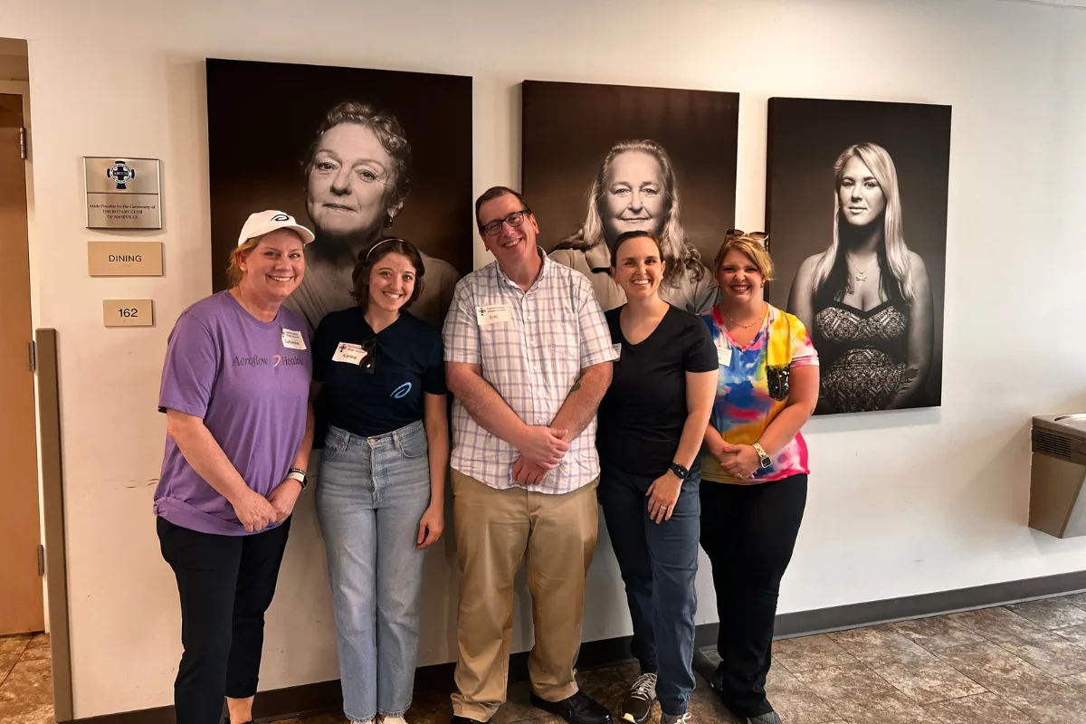 Group posing indoors at event