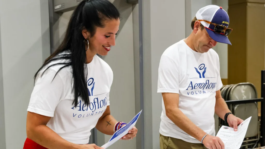 Two people reviewing paper together