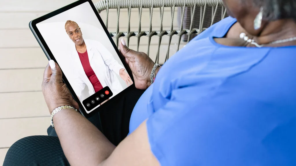 Two people talking in healthcare setting