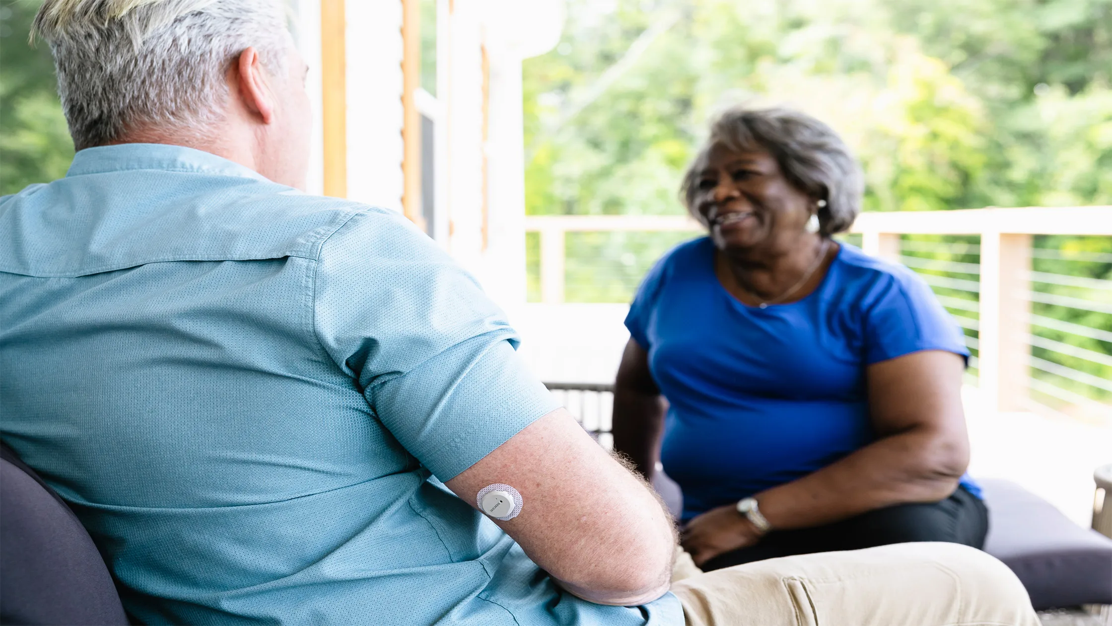 Two people talking in outdoors setting
