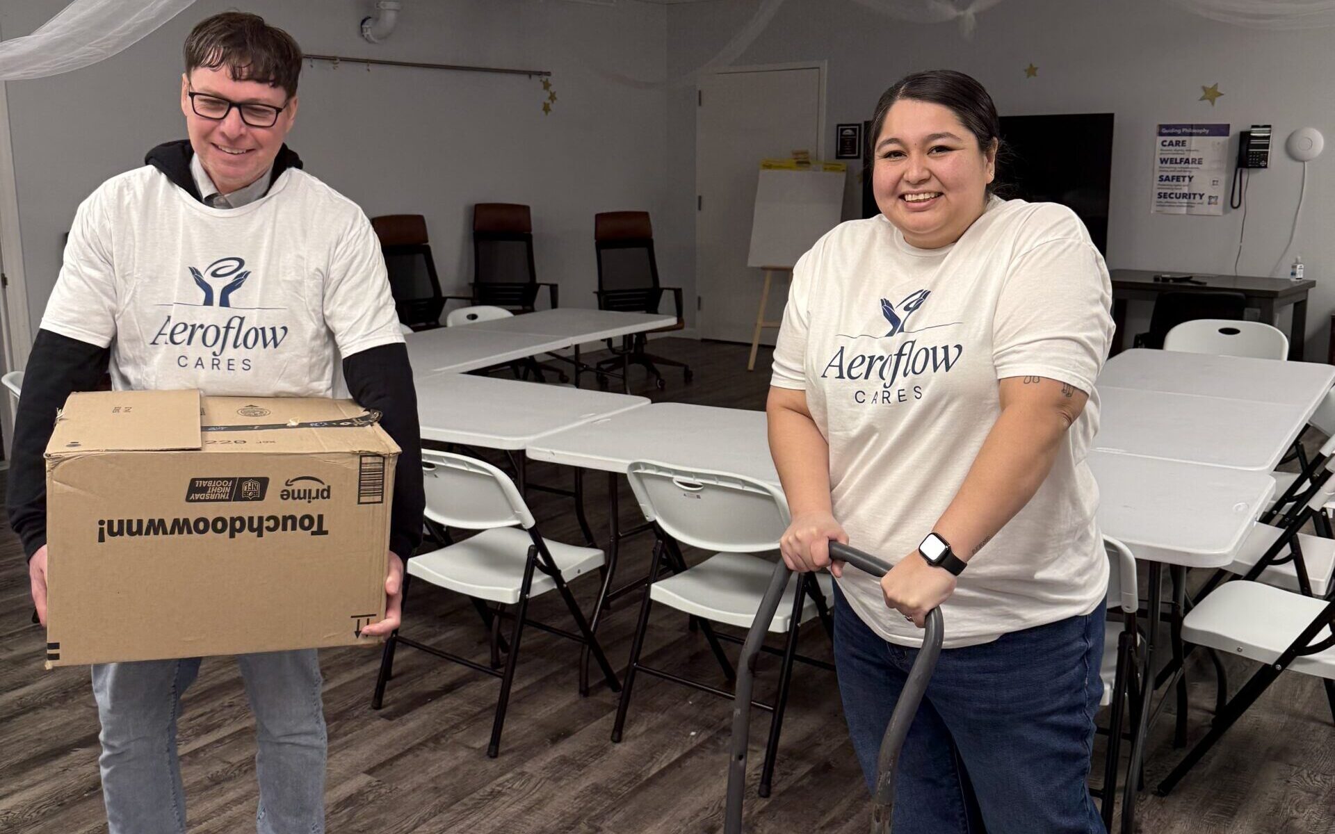 Volunteers working indoors with tools