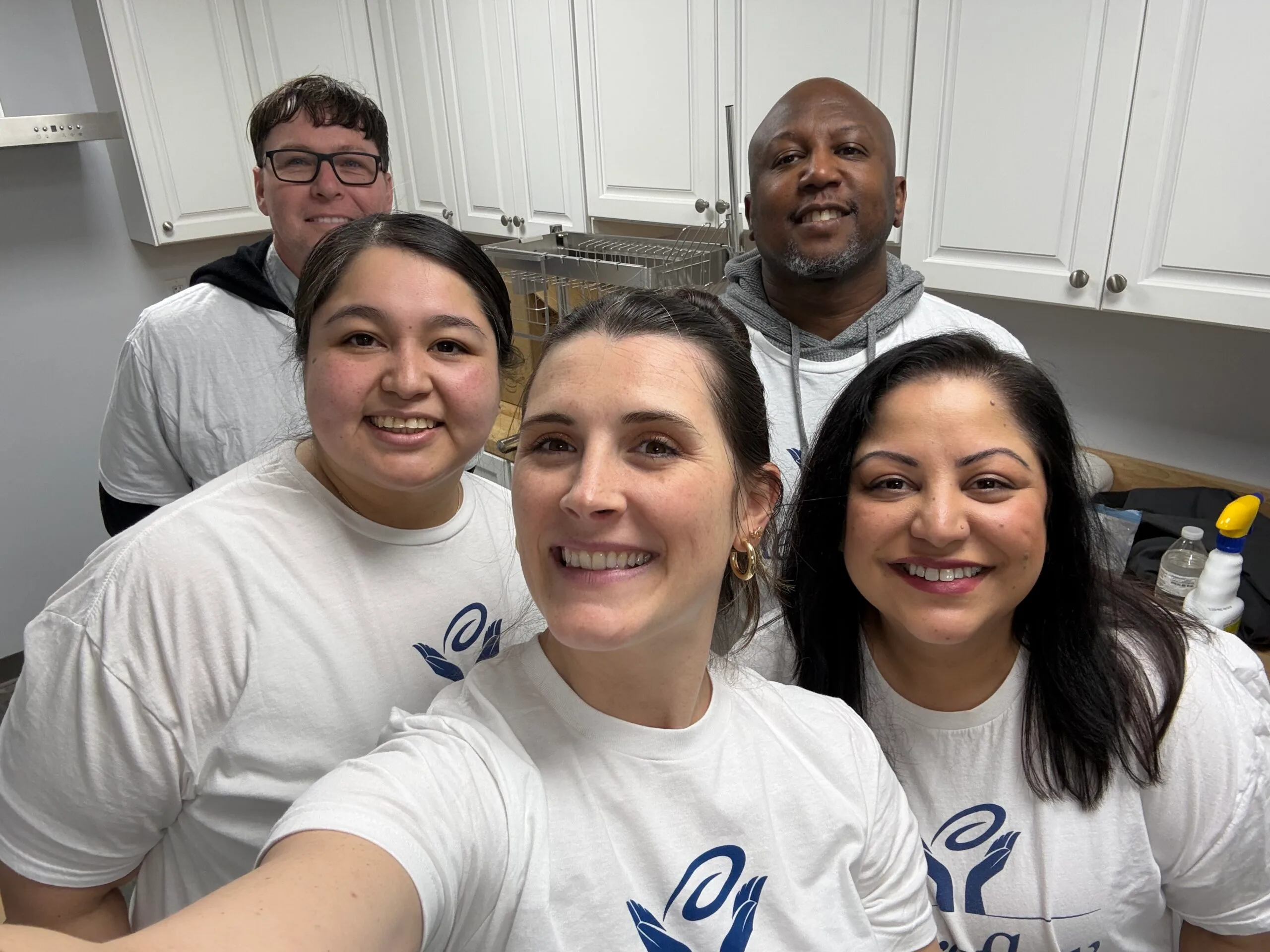 Group selfie of smiling volunteers