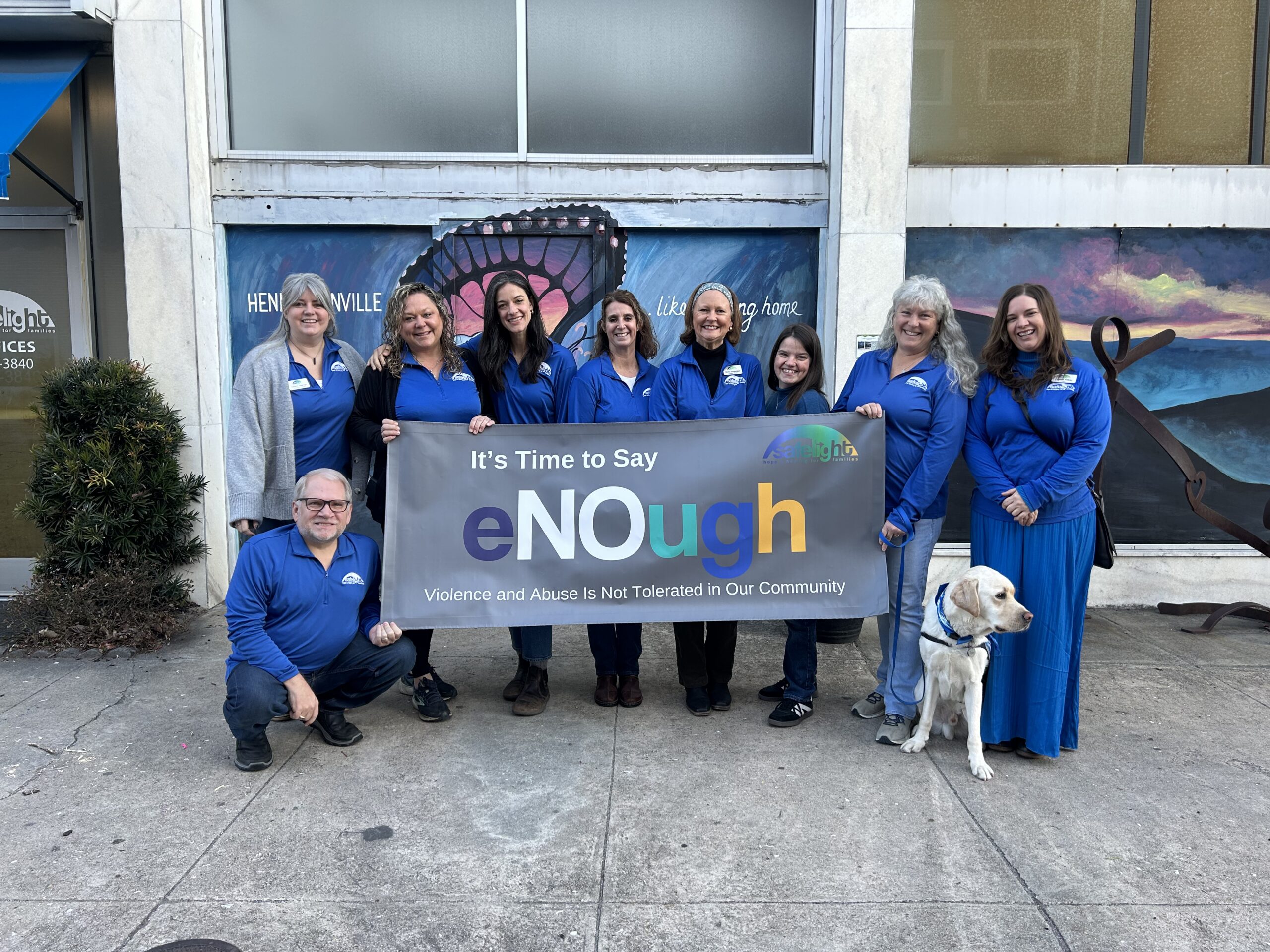 Volunteers holding banner at group event