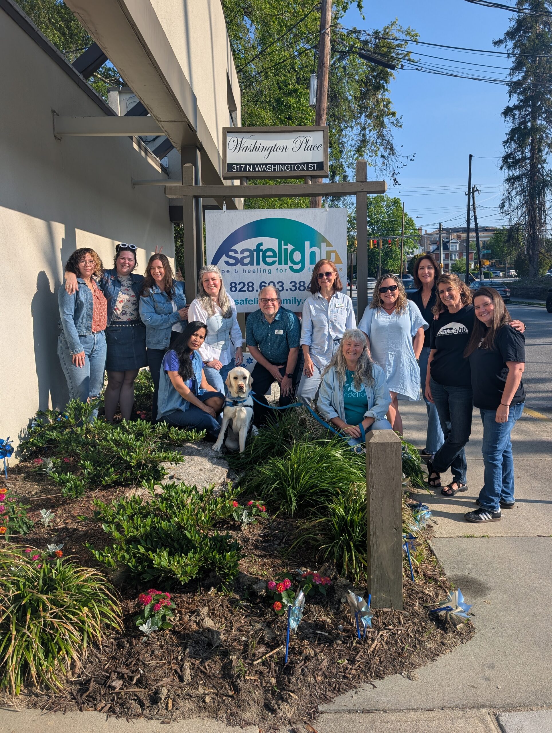 Group standing outdoors at community event