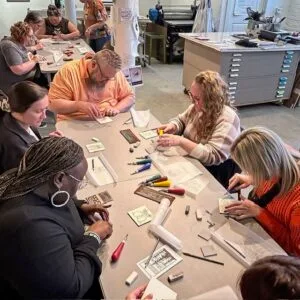 Group crafting or assembling items at table